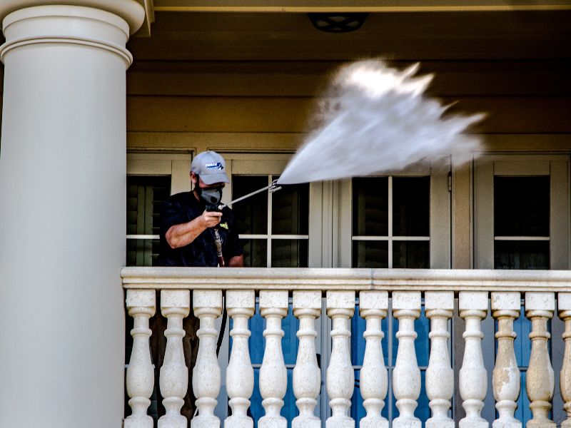 Action shot of our pressure washing service.