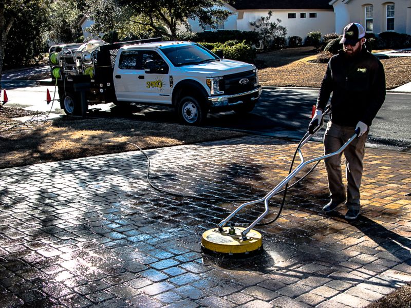 The Sunco team cleaning paver stones at a home in Bluffton.