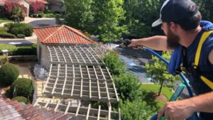 soft pressure washing a home roof on Hilton Head Island